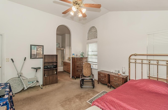 4223 W Yale Ave, Fresno, CA 93722 - bedroom featuring vaulted ceiling, arched walkways, light colored carpet, a ceiling fan, and ensuite bathroom
