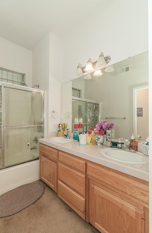 4223 W Yale Ave, Fresno, CA 93722 - full bath with double vanity and bath / shower combo with glass door