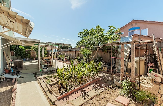 4223 W Yale Ave, Fresno, CA 93722 - fenced backyard with a patio and a pergola