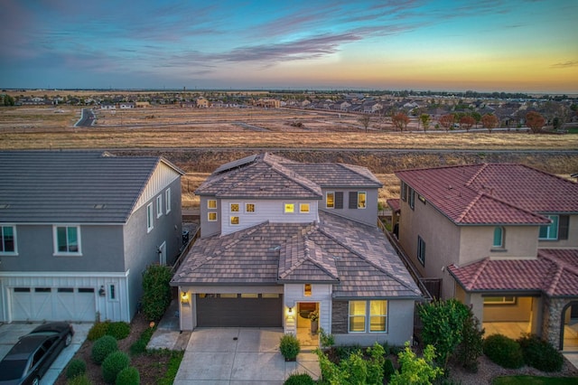 4284 Hillside Rd, Madera, CA 93636 - view of front facade featuring concrete driveway, stucco siding, a residential view, and an attached garage