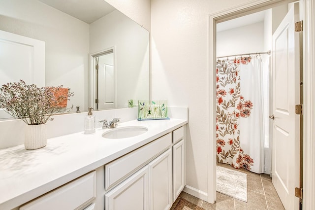 4284 Hillside Rd, Madera, CA 93636 - full bathroom featuring vanity, tile patterned floors, a shower with curtain, and baseboards