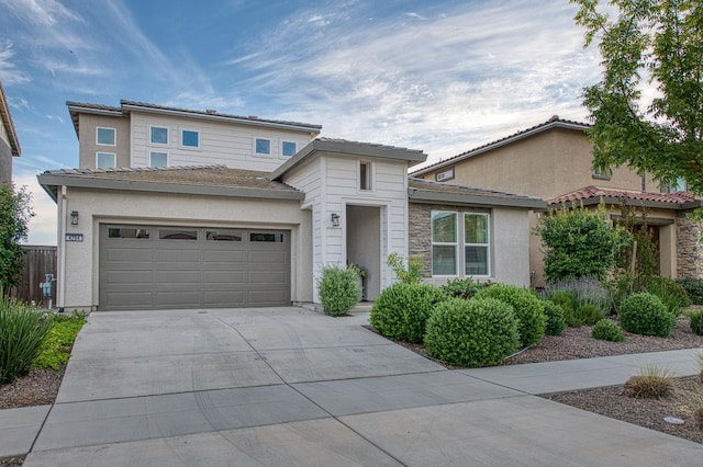 4284 Hillside Rd, Madera, CA 93636 - view of front of home featuring driveway, stucco siding, and a garage