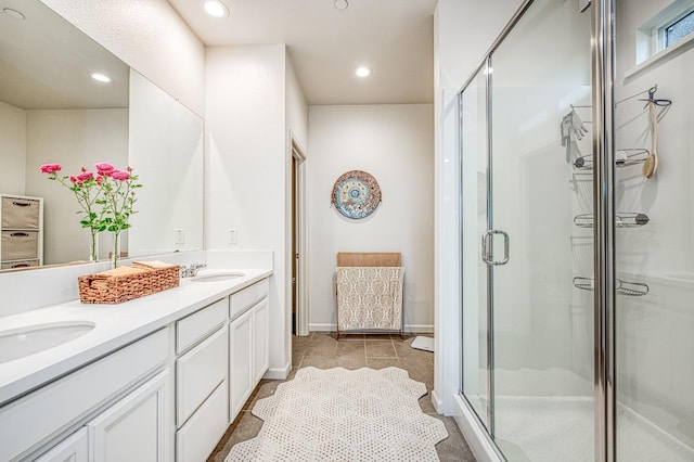 4284 Hillside Rd, Madera, CA 93636 - full bathroom featuring double vanity, a shower stall, recessed lighting, and baseboards