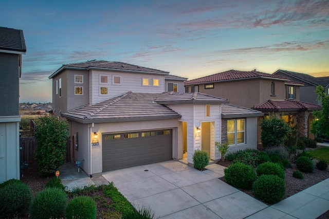 4284 Hillside Rd, Madera, CA 93636 - view of front of property with concrete driveway, an attached garage, a tile roof, and stucco siding