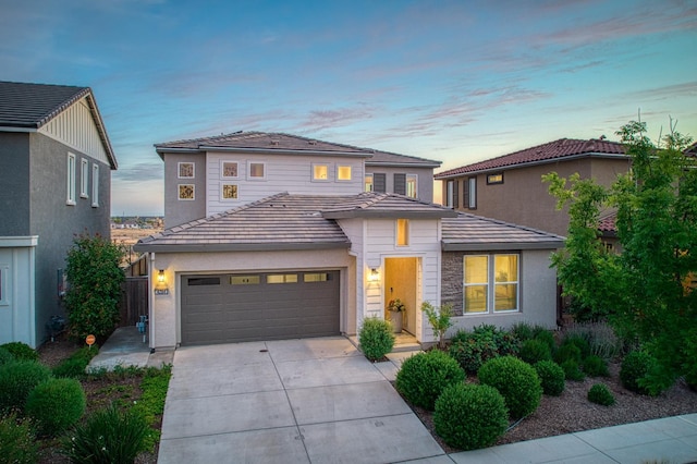 4284 Hillside Rd, Madera, CA 93636 - view of front of house with concrete driveway, an attached garage, stucco siding, and a tile roof
