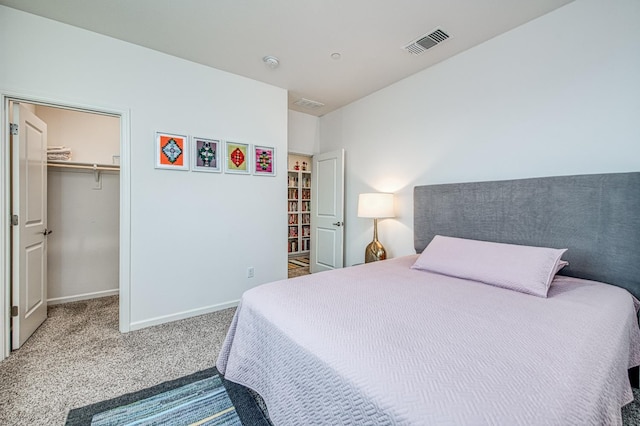 4284 Hillside Rd, Madera, CA 93636 - bedroom with carpet flooring, a spacious closet, baseboards, and a closet