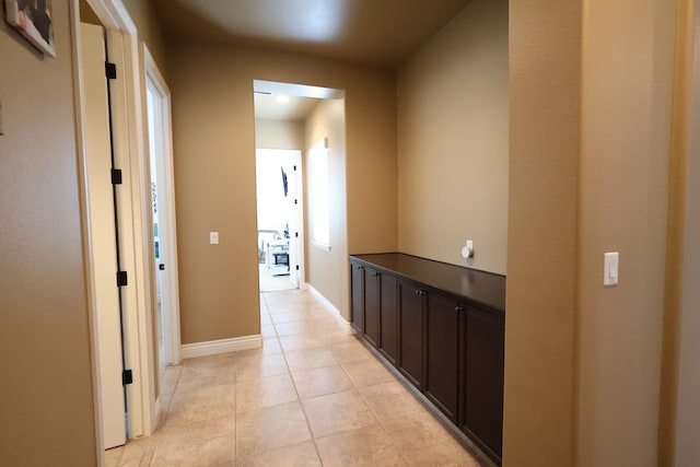 3309 Beverly Ave, Clovis, CA 93619 - corridor featuring light tile patterned floors and baseboards