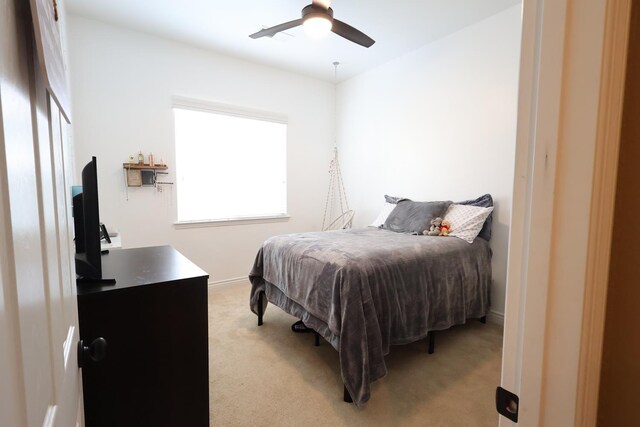 3309 Beverly Ave, Clovis, CA 93619 - bedroom with light carpet, a ceiling fan, and baseboards