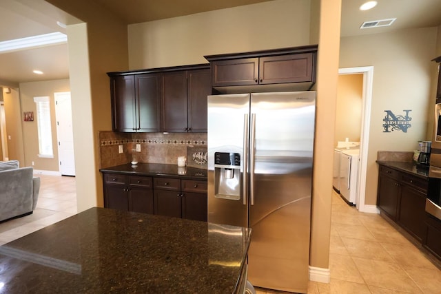 3309 Beverly Ave, Clovis, CA 93619 - kitchen featuring stainless steel fridge with ice dispenser, independent washer and dryer, light tile patterned flooring, dark brown cabinets, and recessed lighting