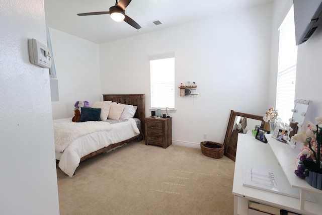 3309 Beverly Ave, Clovis, CA 93619 - bedroom with multiple windows, light carpet, and ceiling fan