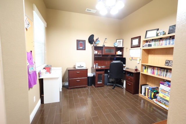 3309 Beverly Ave, Clovis, CA 93619 - home office with a chandelier, dark wood-type flooring, and baseboards