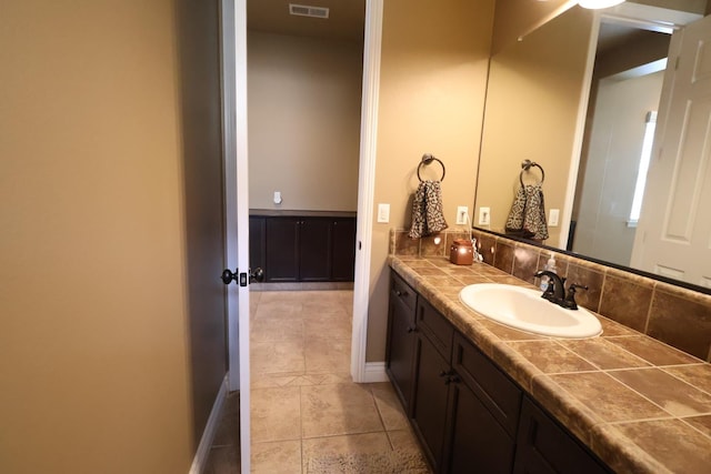 3309 Beverly Ave, Clovis, CA 93619 - bathroom with vanity, baseboards, and tile patterned flooring