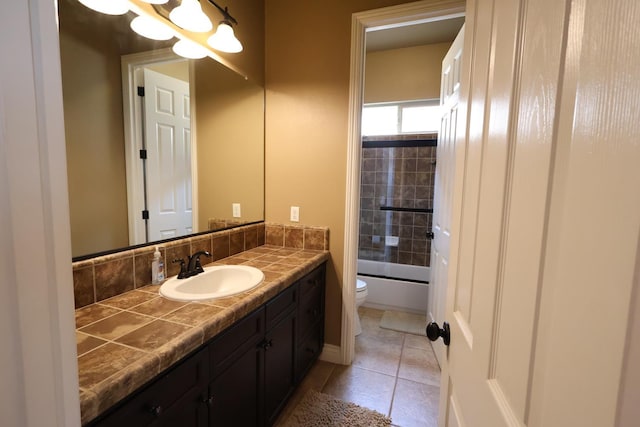 3309 Beverly Ave, Clovis, CA 93619 - full bathroom featuring toilet, vanity, tile patterned floors, and shower / tub combination