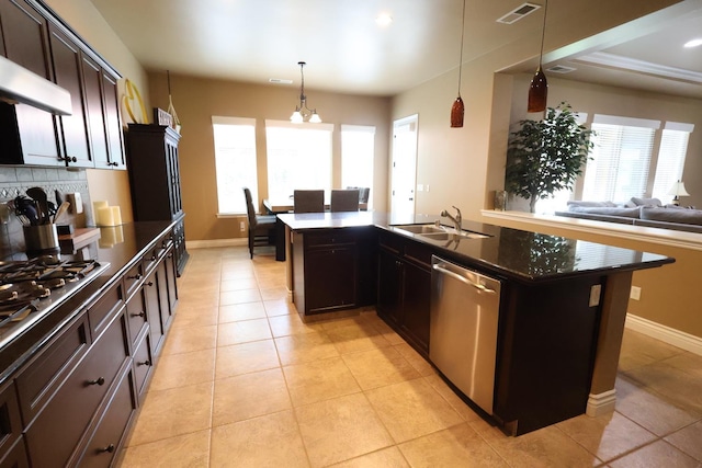 3309 Beverly Ave, Clovis, CA 93619 - kitchen with appliances with stainless steel finishes, light tile patterned floors, dark brown cabinetry, decorative light fixtures, and open floor plan