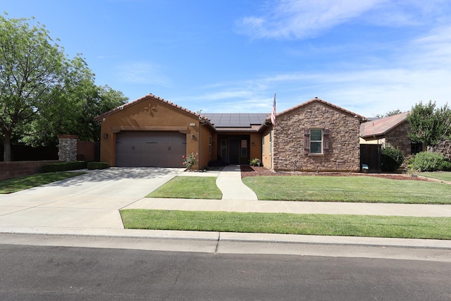 3309 Beverly Ave, Clovis, CA 93619 - single story home with roof mounted solar panels, stucco siding, a garage, stone siding, and a front yard