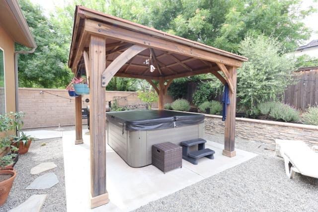 3309 Beverly Ave, Clovis, CA 93619 - fenced backyard with a hot tub, a gazebo, and a patio area