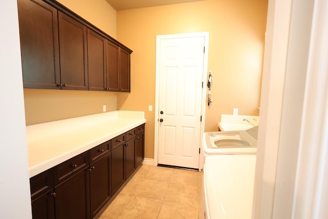 3309 Beverly Ave, Clovis, CA 93619 - washroom with cabinet space, washing machine and clothes dryer, and light tile patterned flooring