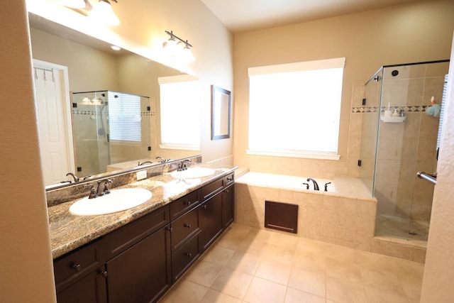 3309 Beverly Ave, Clovis, CA 93619 - full bathroom with tile patterned flooring, a bath, a stall shower, and double vanity
