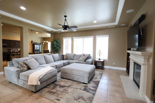 3309 Beverly Ave, Clovis, CA 93619 - living room with light tile patterned flooring, a ceiling fan, a fireplace, baseboards, and recessed lighting