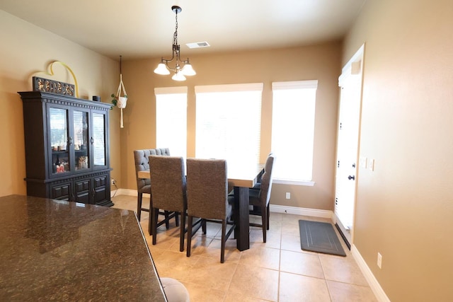 3309 Beverly Ave, Clovis, CA 93619 - dining room with light tile patterned floors and baseboards