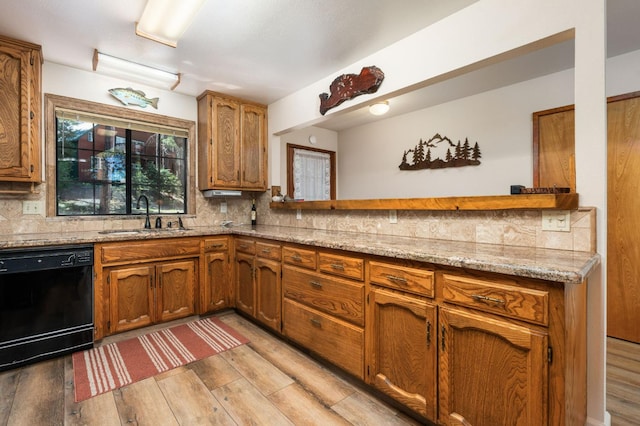 40758 Cold Springs Ln, Shaver Lake, CA 93664 - kitchen with black dishwasher, a sink, backsplash, and light wood-style floors