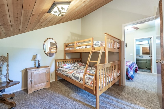 40814 Village Pass Ln, Shaver Lake, CA 93664 - carpeted bedroom with vaulted ceiling, wood ceiling, a sink, baseboards, and ensuite bath