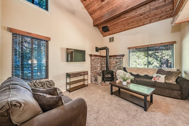 40814 Village Pass Ln, Shaver Lake, CA 93664 - living area featuring wood ceiling with exposed beams, a wood stove, carpet flooring, and high vaulted ceiling