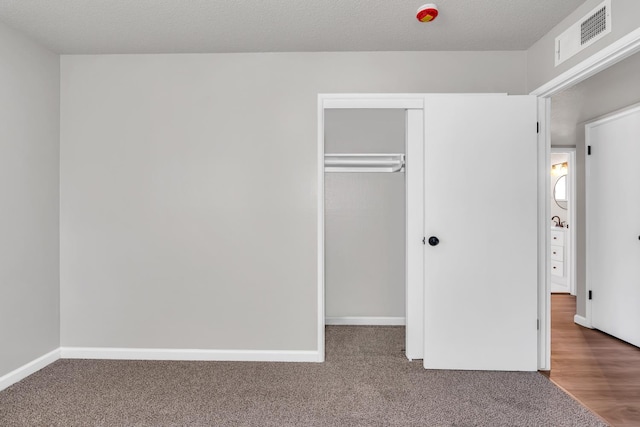 708 E San Jose Ave, Fresno, CA 93710 - unfurnished bedroom featuring a closet, carpet, and baseboards
