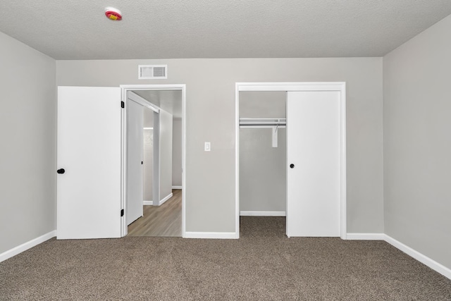 708 E San Jose Ave, Fresno, CA 93710 - unfurnished bedroom with carpet flooring, a closet, baseboards, and a textured ceiling