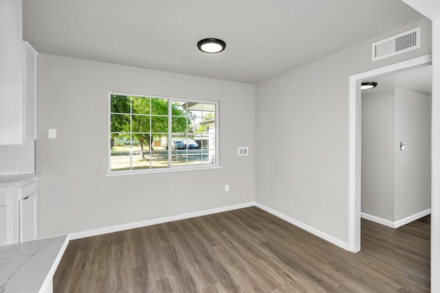 708 E San Jose Ave, Fresno, CA 93710 - unfurnished dining area with wood finished floors and baseboards