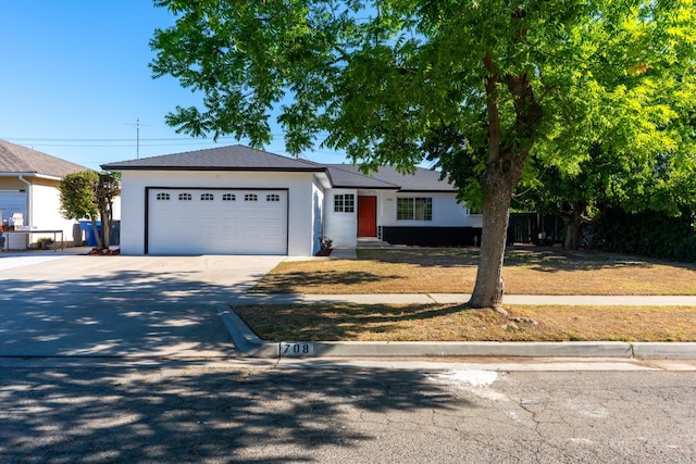 708 E San Jose Ave, Fresno, CA 93710 - ranch-style home featuring an attached garage, concrete driveway, and stucco siding