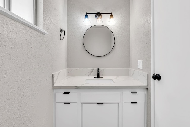 708 E San Jose Ave, Fresno, CA 93710 - bathroom featuring a textured wall and vanity