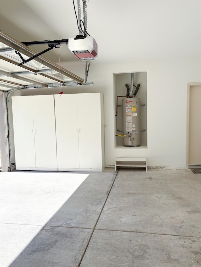 2300 Sierra Ave Unit 129, Kingsburg, CA 93631 - garage with secured water heater and a garage door opener