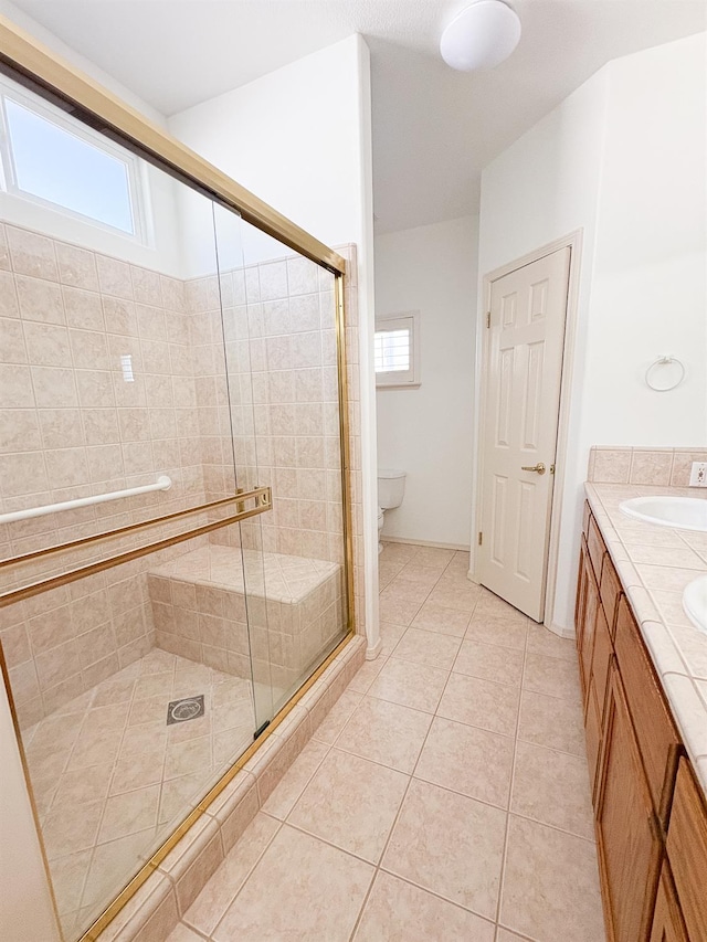 2300 Sierra Ave Unit 129, Kingsburg, CA 93631 - full bath with a stall shower, tile patterned flooring, double vanity, and toilet