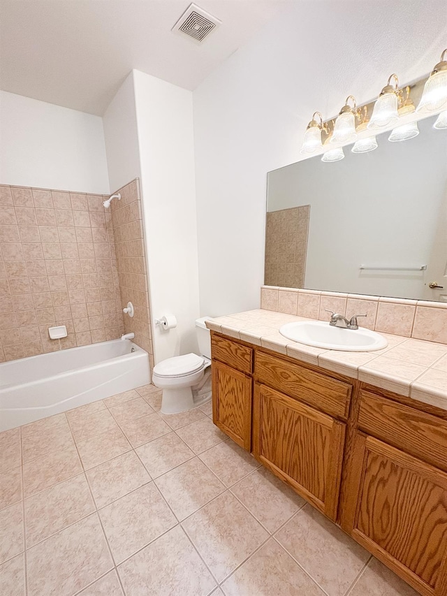 2300 Sierra Ave Unit 129, Kingsburg, CA 93631 - full bath featuring vanity, toilet, tile patterned flooring, and shower / tub combination