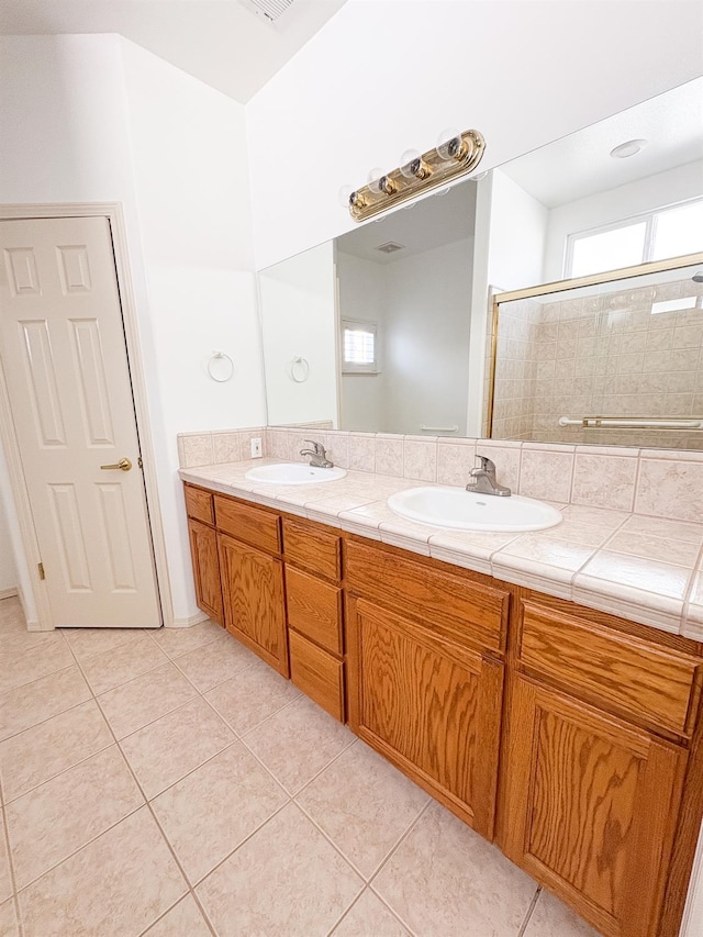 2300 Sierra Ave Unit 129, Kingsburg, CA 93631 - full bath featuring double vanity, a stall shower, and tile patterned floors