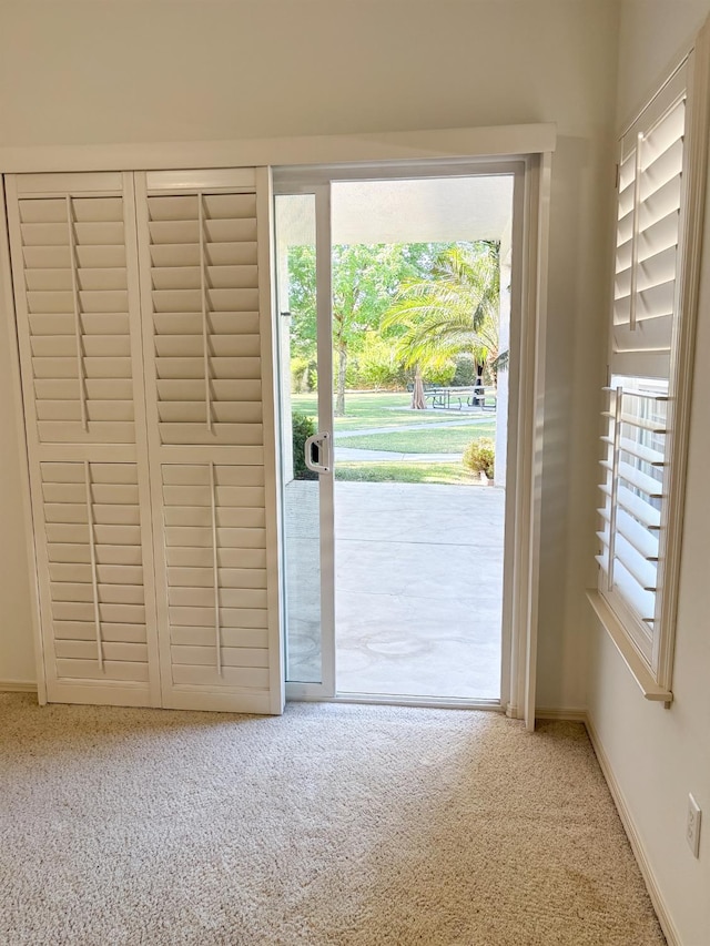 2300 Sierra Ave Unit 129, Kingsburg, CA 93631 - doorway with carpet and baseboards