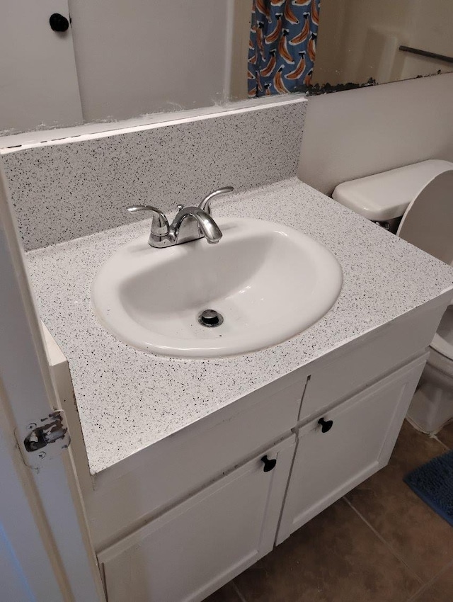 3332 W Shields Ave Unit 101, Fresno, CA 93722 - bathroom with toilet, vanity, a shower with shower curtain, and tile patterned flooring