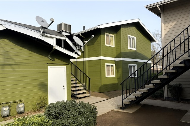 3332 W Shields Ave Unit 101, Fresno, CA 93722 - rear view of property with stairway and cooling unit