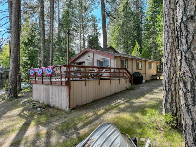 44468 Lakeview Ave, Shaver Lake, CA 93664 - view of side of home with a wooden deck and a chimney
