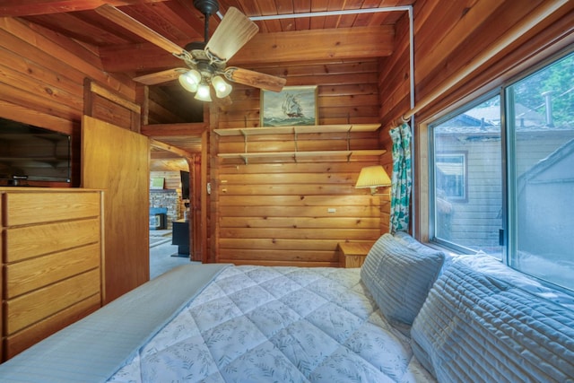 44468 Lakeview Ave, Shaver Lake, CA 93664 - bedroom with wooden walls, wooden ceiling with exposed beams, and access to exterior