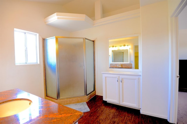 621 E Keats Ave, Fresno, CA 93710 - full bathroom with vanity, a stall shower, and wood finished floors