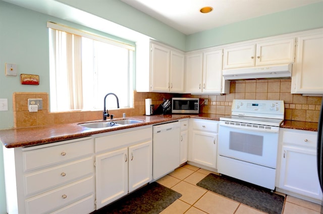 621 E Keats Ave, Fresno, CA 93710 - kitchen featuring white appliances, under cabinet range hood, a sink, decorative backsplash, and white cabinetry