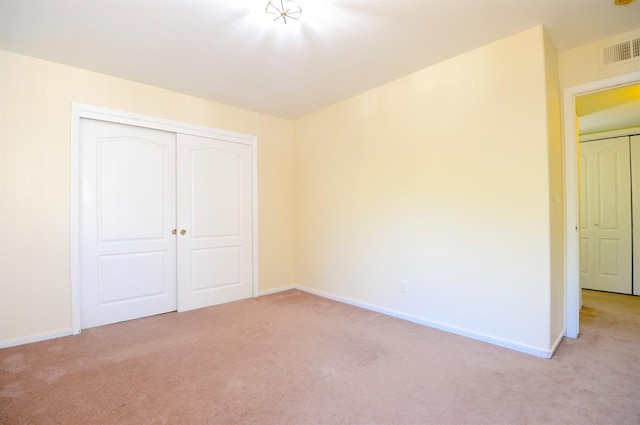 621 E Keats Ave, Fresno, CA 93710 - unfurnished bedroom with light carpet, baseboards, and a closet