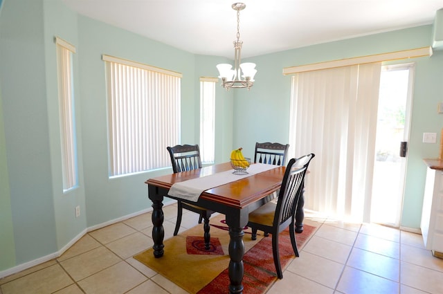 621 E Keats Ave, Fresno, CA 93710 - dining space featuring light tile patterned flooring, a chandelier, and baseboards