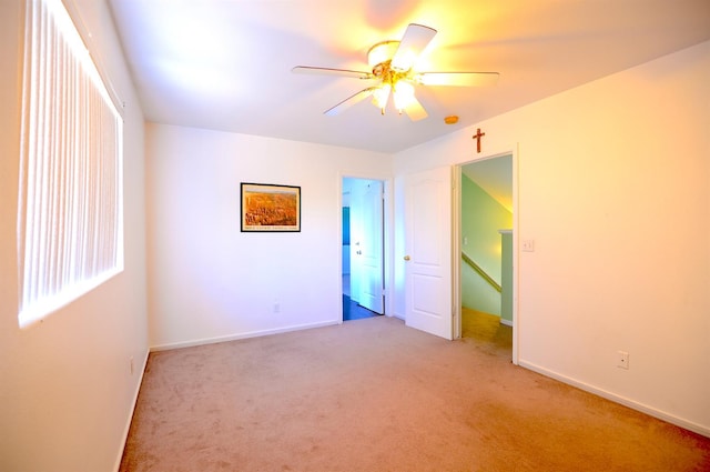 621 E Keats Ave, Fresno, CA 93710 - unfurnished bedroom with light carpet, baseboards, and a ceiling fan