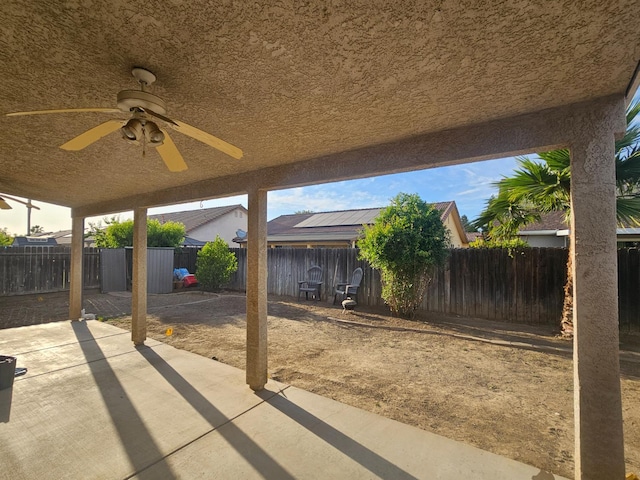 3351 Winter Way, Madera, CA 93637 - fenced backyard with a patio area and ceiling fan