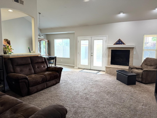 3351 Winter Way, Madera, CA 93637 - carpeted living area featuring arched walkways, a premium fireplace, baseboards, french doors, and recessed lighting
