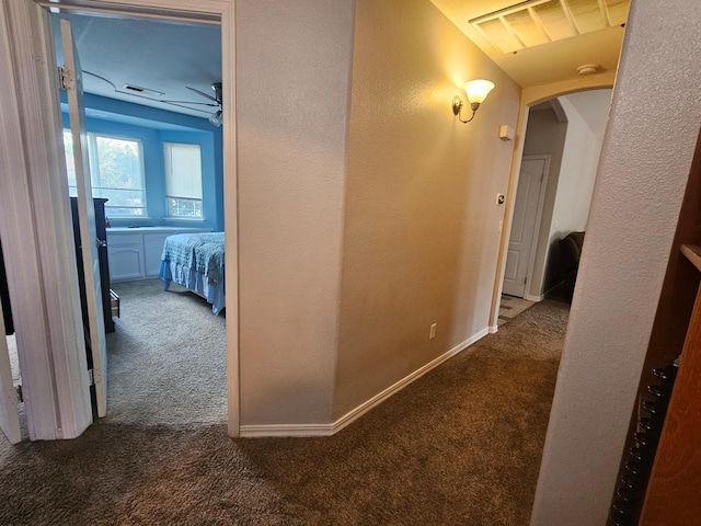 3351 Winter Way, Madera, CA 93637 - corridor featuring carpet floors, arched walkways, a textured wall, and baseboards