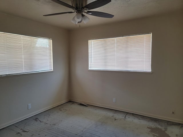 3023 E Robinson Ave, Fresno, CA 93726 - spare room featuring ceiling fan, healthy amount of natural light, and baseboards